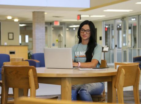 female student in library