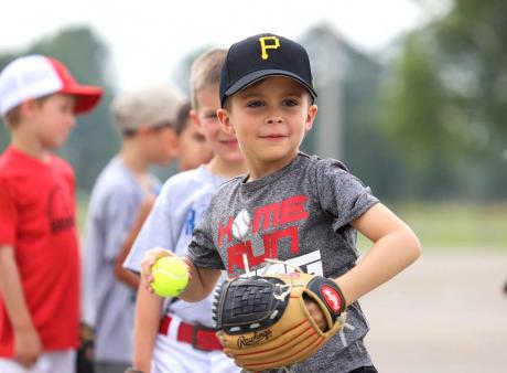 boy throwing baseball