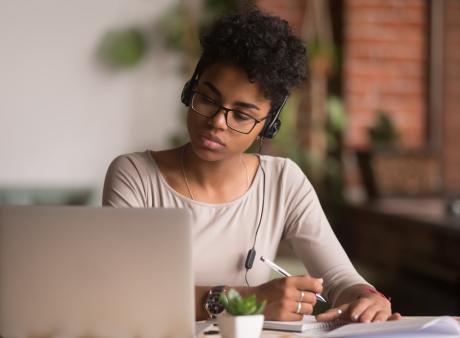 female student in front of a laptop