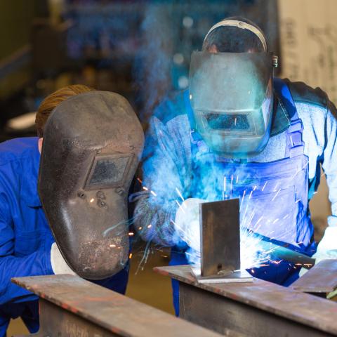 welding student and teacher