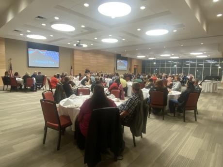 tables at attendees at the veterans day event