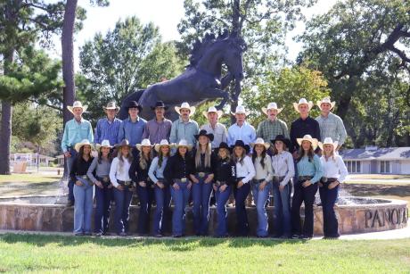 Panola College rodeo team standing infront of the Panola College Pony fountain