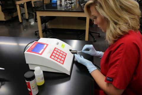 MLT student runs lab tests