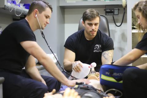 EMT students work on mannequien