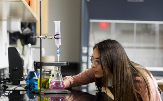 female student with beaker