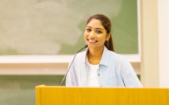 female giving speech